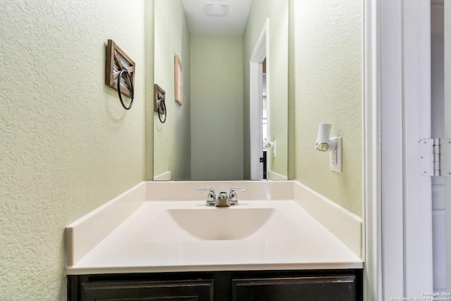 4351 E Safe Hbr, San Antonio, TX 78244 - bathroom with a textured wall and vanity