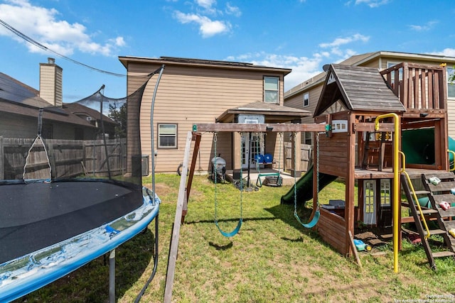 4351 E Safe Hbr, San Antonio, TX 78244 - view of play area with a trampoline, a yard, and central AC