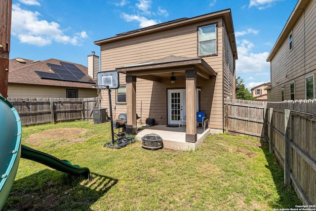 4351 E Safe Hbr, San Antonio, TX 78244 - rear view of property featuring a patio, an outdoor fire pit, and central AC