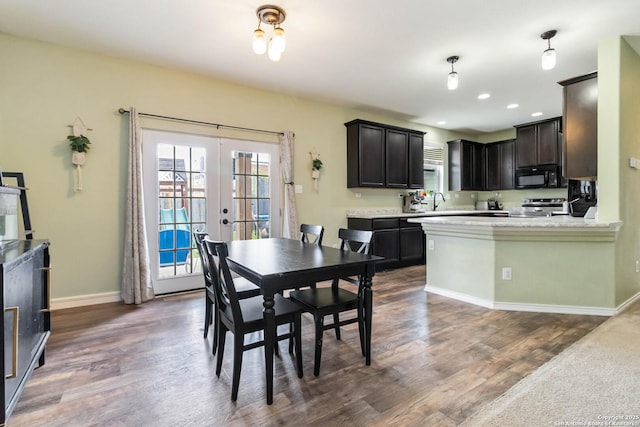 4351 E Safe Hbr, San Antonio, TX 78244 - dining space with french doors, dark wood finished floors, baseboards, and recessed lighting