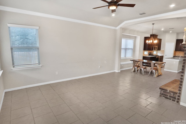 8228 Llano Parke, San Antonio, TX 78254 - tiled living room with a chandelier, a ceiling fan, ornamental molding, baseboards, and recessed lighting
