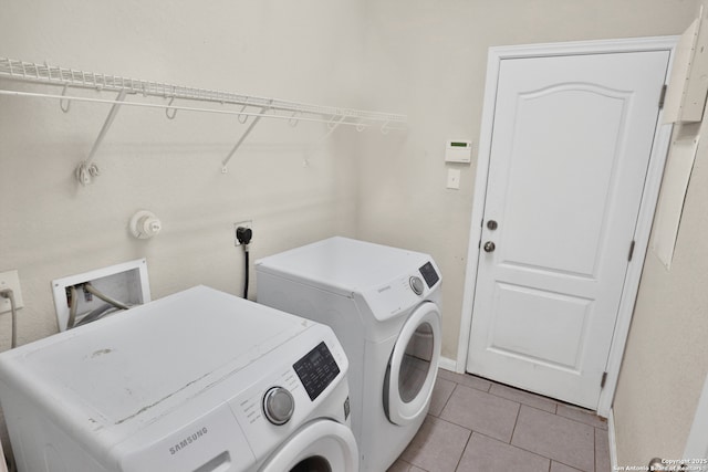 8228 Llano Parke, San Antonio, TX 78254 - clothes washing area with independent washer and dryer and light tile patterned flooring