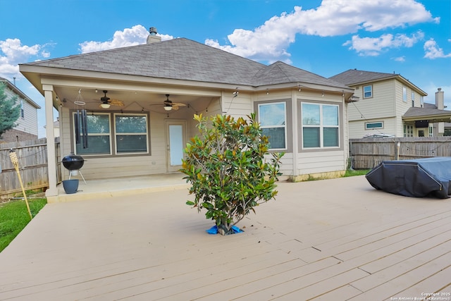 8228 Llano Parke, San Antonio, TX 78254 - back of property with a ceiling fan, a deck, a fenced backyard, and roof with shingles