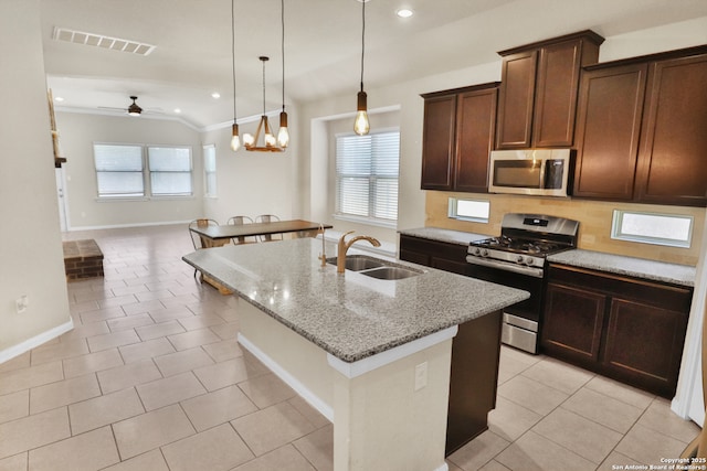 8228 Llano Parke, San Antonio, TX 78254 - kitchen featuring appliances with stainless steel finishes, a sink, an island with sink, crown molding, and ceiling fan