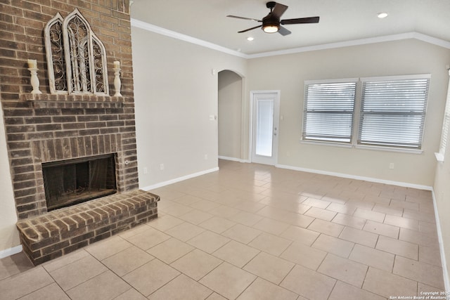 8228 Llano Parke, San Antonio, TX 78254 - unfurnished living room featuring a ceiling fan, arched walkways, tile patterned flooring, crown molding, and a brick fireplace