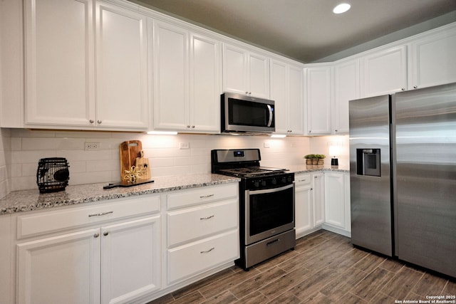 565 Rosemellow, New Braunfels, TX 78132 - kitchen featuring stainless steel appliances, white cabinets, decorative backsplash, dark wood-type flooring, and recessed lighting