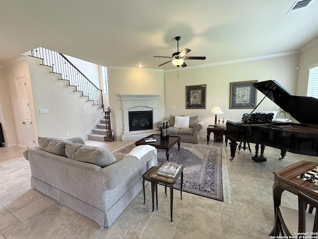 25215 Estancia, San Antonio, TX 78260 - living room featuring a ceiling fan, ornamental molding, a premium fireplace, stairs, and baseboards