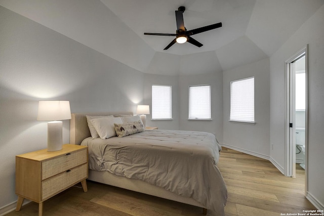772 Lakebreeze, Canyon Lake, TX 78133 - bedroom featuring light wood-style flooring, multiple windows, lofted ceiling, and baseboards