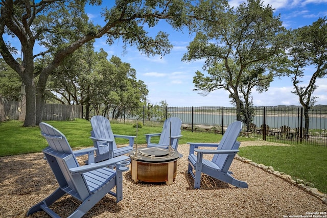 772 Lakebreeze, Canyon Lake, TX 78133 - view of yard with an outdoor fire pit and a water view