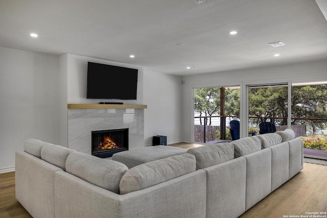 772 Lakebreeze, Canyon Lake, TX 78133 - living room featuring recessed lighting, a fireplace, wood finished floors, and baseboards