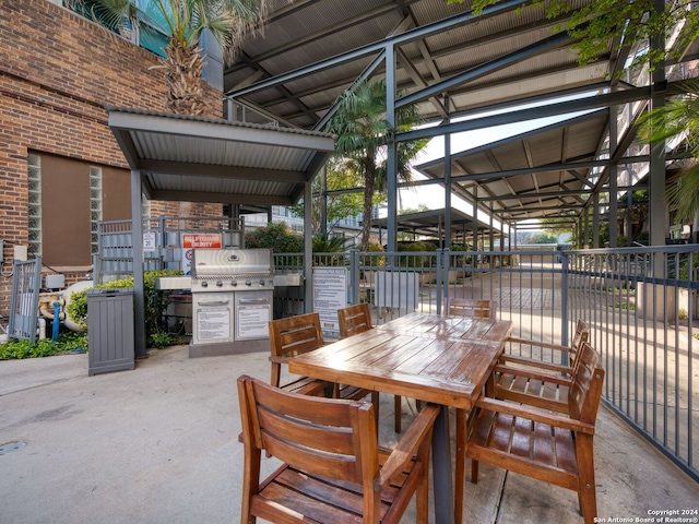 1339 S Flores St Unit 103, San Antonio, TX 78204 - view of patio featuring area for grilling and outdoor dining area