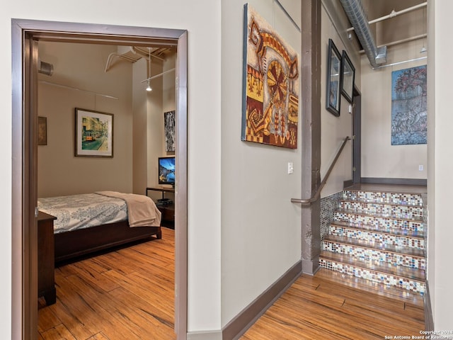 1339 S Flores St Unit 103, San Antonio, TX 78204 - hall with wood finished floors and baseboards