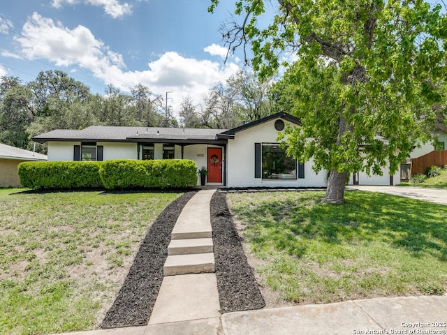 view of front facade with concrete driveway and a garage