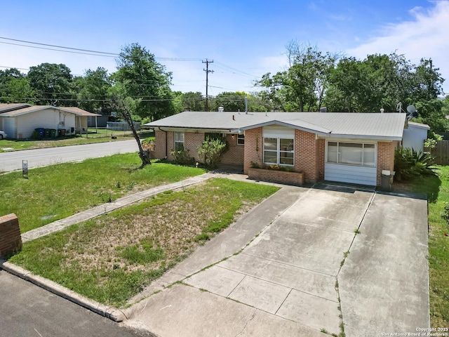 286 Goodhue, San Antonio, TX 78218 - ranch-style house with brick siding, concrete driveway, and a front lawn