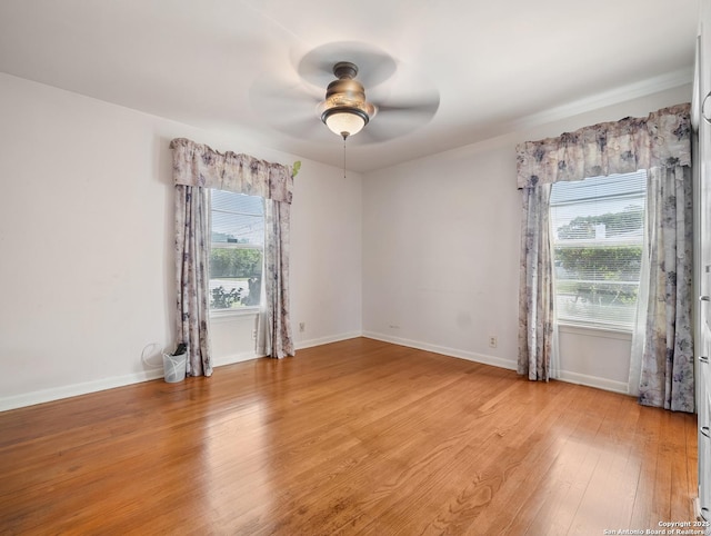 286 Goodhue, San Antonio, TX 78218 - spare room with light wood finished floors, ceiling fan, and baseboards