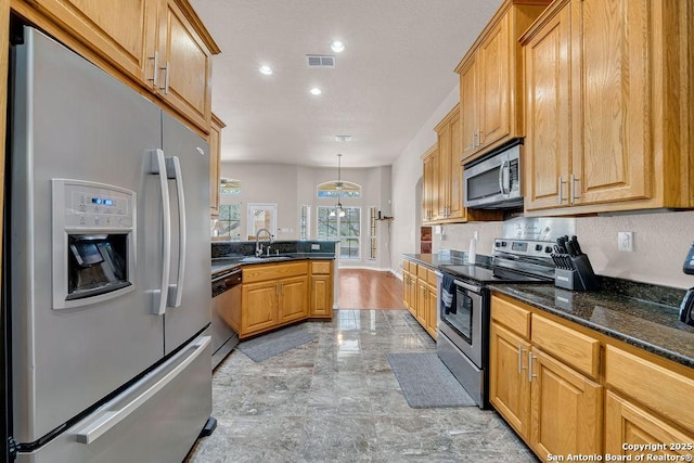 108 Medora Br, Floresville, TX 78114 - kitchen featuring stainless steel appliances, light marble finish flooring, a sink, recessed lighting, and a peninsula