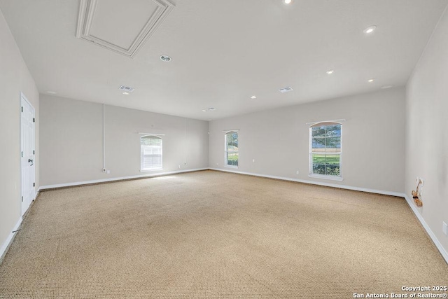 108 Medora Br, Floresville, TX 78114 - unfurnished room featuring carpet, baseboards, recessed lighting, and attic access