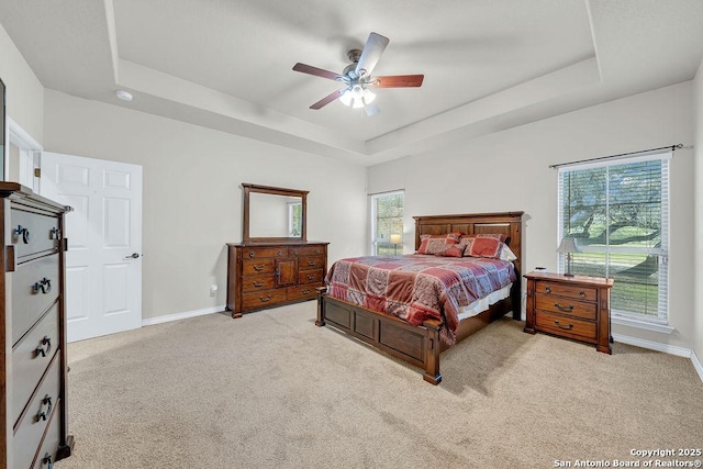 108 Medora Br, Floresville, TX 78114 - bedroom with a raised ceiling, multiple windows, and carpet floors