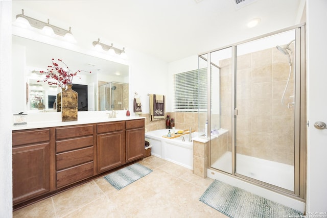 full bath featuring a shower stall, a bath, tile patterned flooring, and vanity