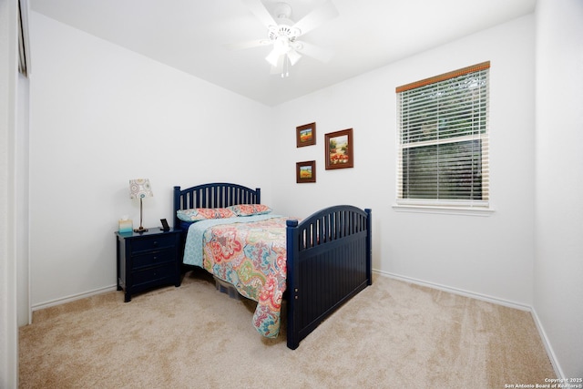 bedroom with carpet, baseboards, and ceiling fan