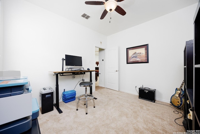 carpeted home office with a ceiling fan and baseboards