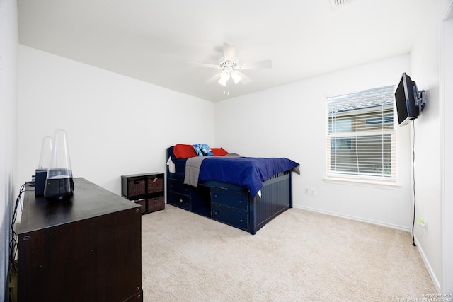 bedroom with carpet, ceiling fan, and baseboards