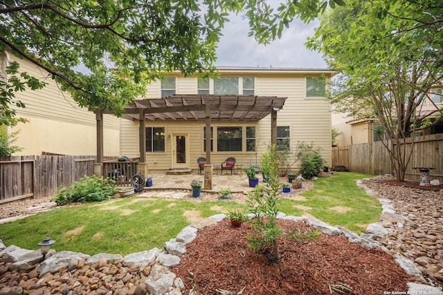 rear view of house with a pergola and a patio