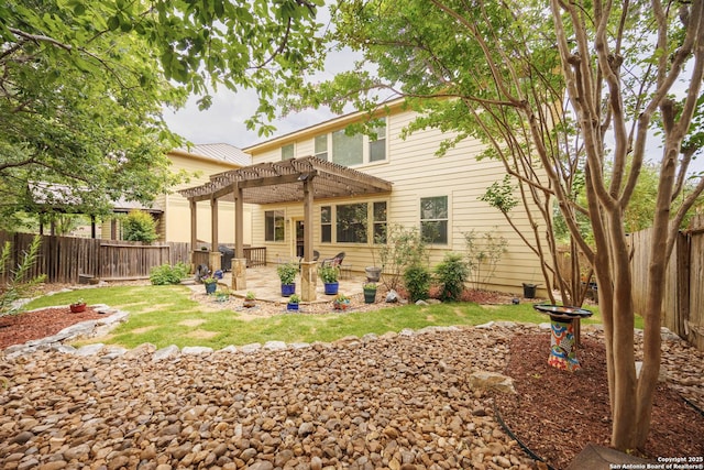 back of property with a pergola, a patio area, and a fenced backyard