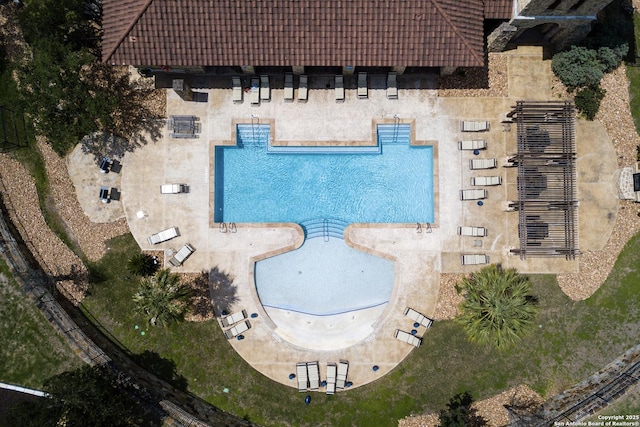 aerial view of property and surrounding area with a pool