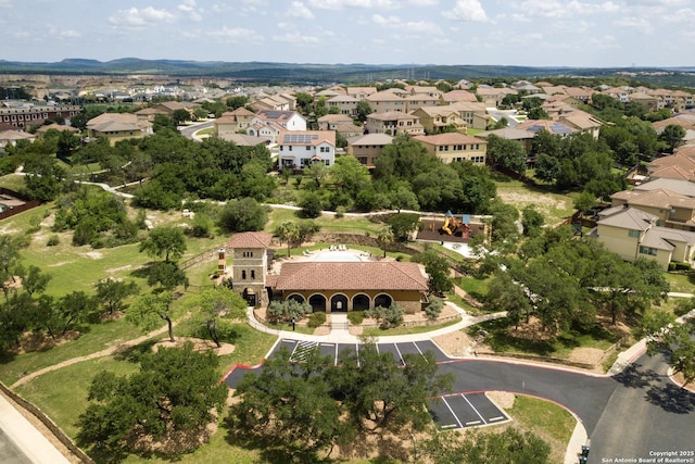 aerial view of property and surrounding area with nearby suburban area