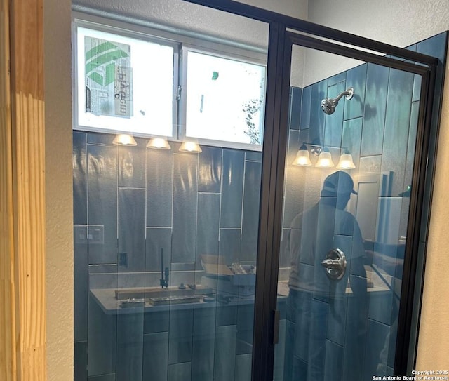 109 Sutton Pl, Uvalde, TX 78801 - bathroom view of a stall shower and a textured wall