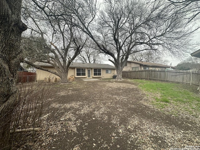 5107 Stockman Dr, San Antonio, TX 78247 - back of property featuring fence and stucco siding