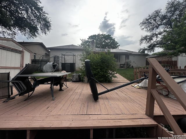wooden deck with outdoor dining area