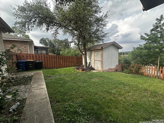 view of yard featuring a shed and an outbuilding