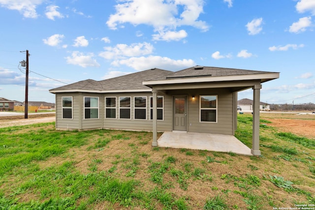 101 Cheyenne Dr, Floresville, TX 78114 - back of house with a patio and a yard