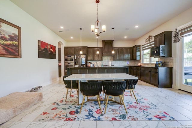4019 Wood Crk, San Antonio, TX 78257 - dining area with light marble finish flooring, arched walkways, a chandelier, recessed lighting, and baseboards