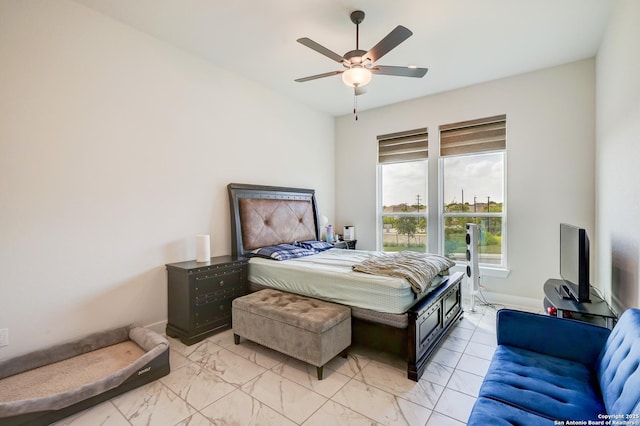 4019 Wood Crk, San Antonio, TX 78257 - bedroom with baseboards, ceiling fan, and light marble finish floors