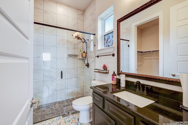 4019 Wood Crk, San Antonio, TX 78257 - bathroom with a stall shower, vanity, and toilet