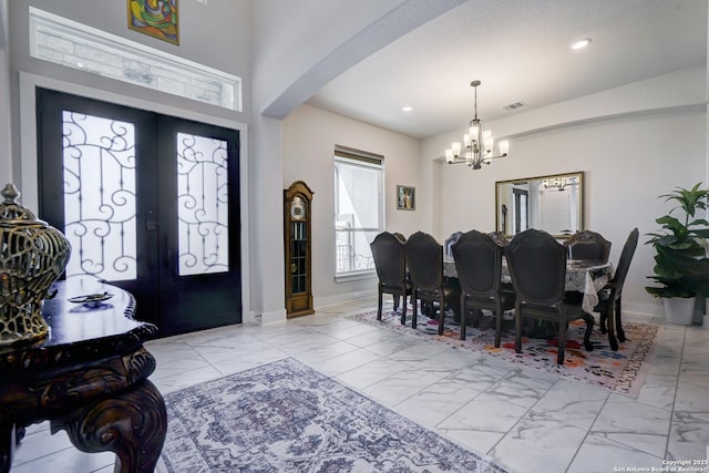4019 Wood Crk, San Antonio, TX 78257 - foyer featuring light marble finish flooring, a chandelier, baseboards, arched walkways, and recessed lighting