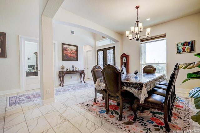 4019 Wood Crk, San Antonio, TX 78257 - dining room featuring arched walkways, a chandelier, light marble finish floors, recessed lighting, and baseboards