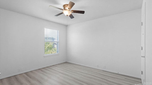 154 Sassafras, Kyle, TX 78640 - empty room with light wood-style floors, ceiling fan, and baseboards