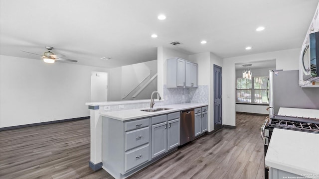 154 Sassafras, Kyle, TX 78640 - kitchen featuring a sink, appliances with stainless steel finishes, light countertops, ceiling fan, and wood finished floors