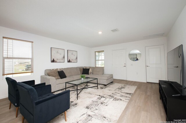 12023 Picard, San Antonio, TX 78221 - living room featuring wood finished floors