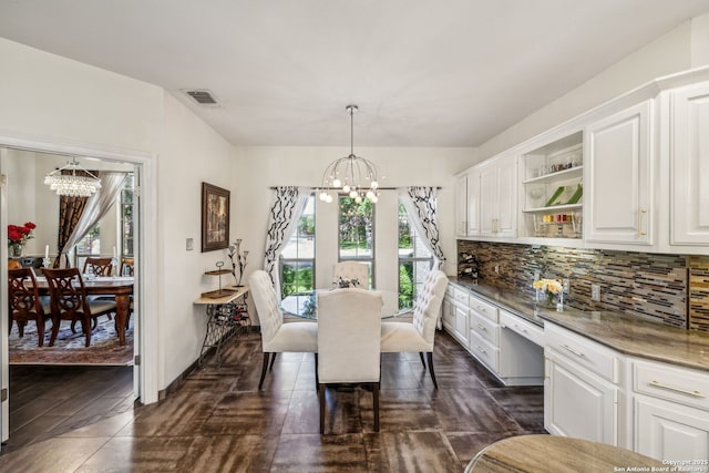 24 Rogers Wood, San Antonio, TX 78248 - dining area with a chandelier, healthy amount of natural light, and dark wood-type flooring
