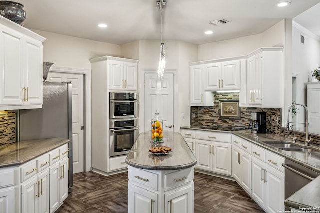24 Rogers Wood, San Antonio, TX 78248 - kitchen with a sink, stainless steel appliances, white cabinets, tasteful backsplash, and recessed lighting