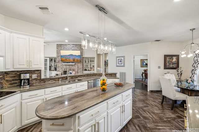 24 Rogers Wood, San Antonio, TX 78248 - kitchen with a sink, tasteful backsplash, a chandelier, light stone countertops, and a center island
