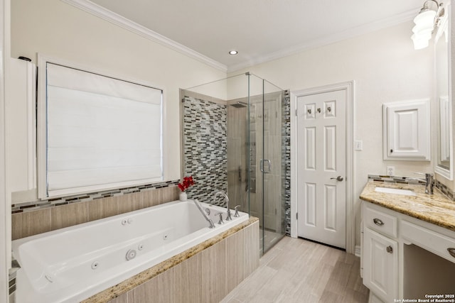 24 Rogers Wood, San Antonio, TX 78248 - bathroom featuring ornamental molding, a tub with jets, vanity, and a shower stall