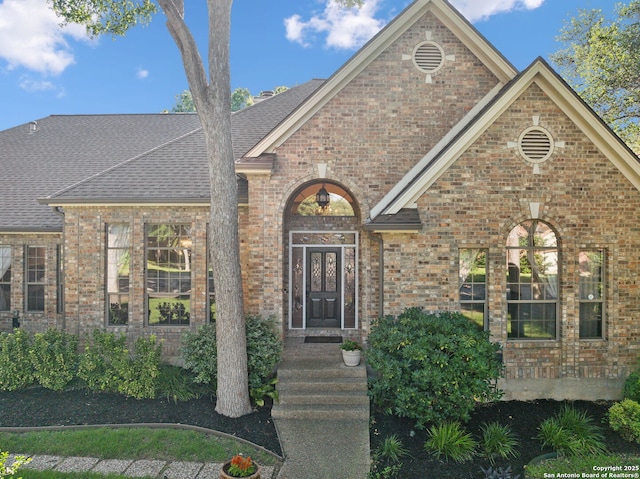 24 Rogers Wood, San Antonio, TX 78248 - view of front of home featuring brick siding and roof with shingles