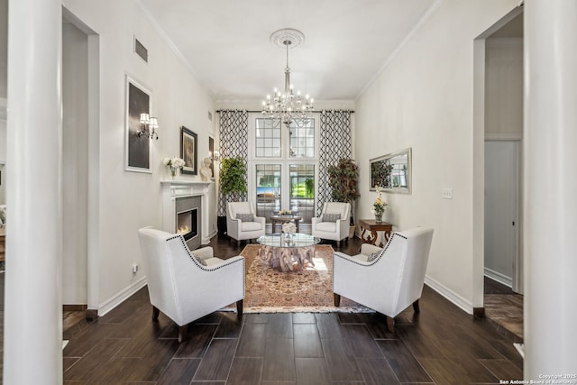 24 Rogers Wood, San Antonio, TX 78248 - living room with ornamental molding, a chandelier, baseboards, a lit fireplace, and dark wood-style flooring