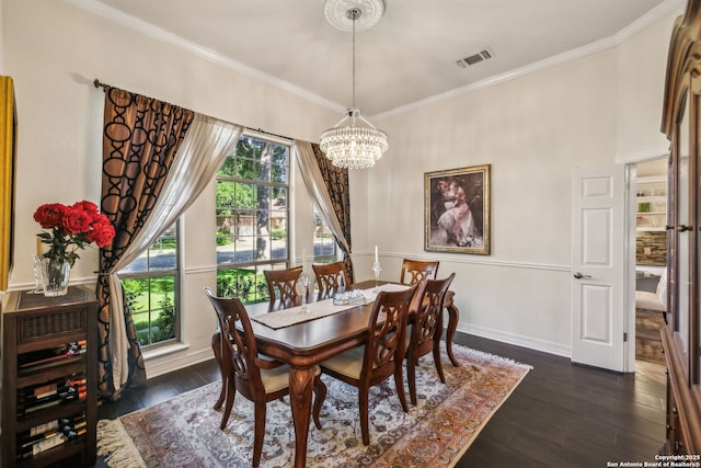 24 Rogers Wood, San Antonio, TX 78248 - dining space with a chandelier, dark wood-type flooring, crown molding, and baseboards